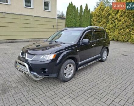 Черный Мицубиси Аутлендер ХЛ, объемом двигателя 2.4 л и пробегом 127 тыс. км за 10500 $, фото 4 на Automoto.ua