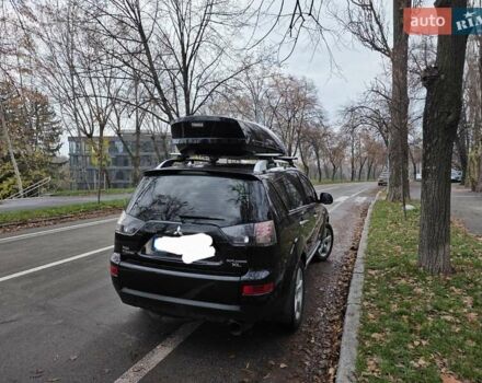 Черный Мицубиси Аутлендер ХЛ, объемом двигателя 2 л и пробегом 186 тыс. км за 10000 $, фото 1 на Automoto.ua