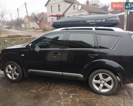 Черный Мицубиси Аутлендер ХЛ, объемом двигателя 2.36 л и пробегом 41 тыс. км за 12000 $, фото 3 на Automoto.ua