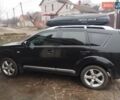 Черный Мицубиси Аутлендер ХЛ, объемом двигателя 2.36 л и пробегом 41 тыс. км за 12000 $, фото 3 на Automoto.ua
