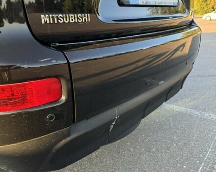 Черный Мицубиси Аутлендер ХЛ, объемом двигателя 2.36 л и пробегом 115 тыс. км за 12000 $, фото 30 на Automoto.ua