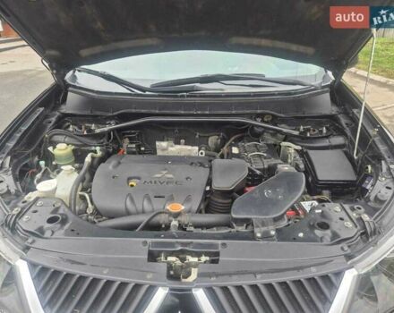 Черный Мицубиси Аутлендер ХЛ, объемом двигателя 2.36 л и пробегом 87 тыс. км за 11500 $, фото 1 на Automoto.ua