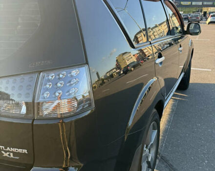 Черный Мицубиси Аутлендер ХЛ, объемом двигателя 2.36 л и пробегом 115 тыс. км за 12000 $, фото 7 на Automoto.ua