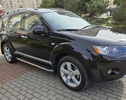 Черный Мицубиси Аутлендер ХЛ, объемом двигателя 2.4 л и пробегом 31 тыс. км за 15000 $, фото 1 на Automoto.ua