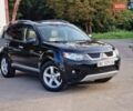 Черный Мицубиси Аутлендер ХЛ, объемом двигателя 2.36 л и пробегом 180 тыс. км за 7800 $, фото 1 на Automoto.ua