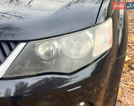 Черный Мицубиси Аутлендер ХЛ, объемом двигателя 3 л и пробегом 285 тыс. км за 9590 $, фото 4 на Automoto.ua