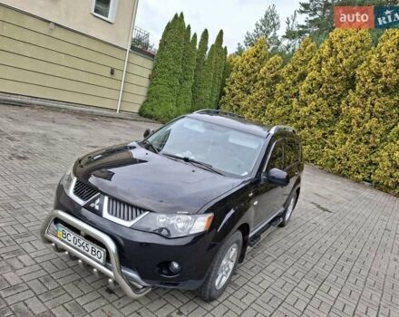 Черный Мицубиси Аутлендер ХЛ, объемом двигателя 2.4 л и пробегом 127 тыс. км за 10500 $, фото 2 на Automoto.ua