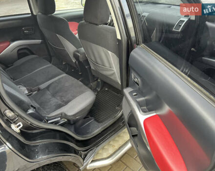 Черный Мицубиси Аутлендер ХЛ, объемом двигателя 2.36 л и пробегом 216 тыс. км за 7500 $, фото 9 на Automoto.ua