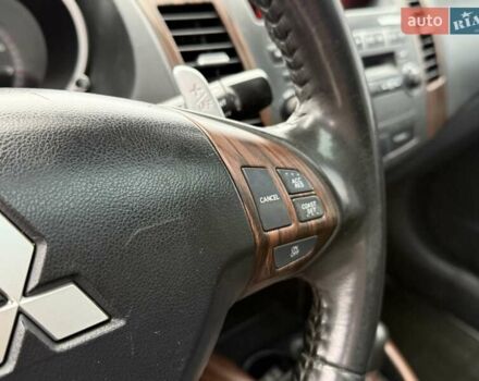 Черный Мицубиси Аутлендер ХЛ, объемом двигателя 2.36 л и пробегом 175 тыс. км за 9700 $, фото 21 на Automoto.ua