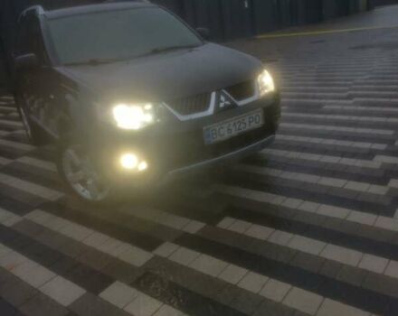 Черный Мицубиси Аутлендер ХЛ, объемом двигателя 2.36 л и пробегом 270 тыс. км за 9200 $, фото 3 на Automoto.ua