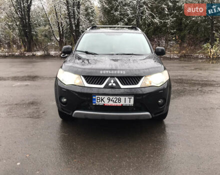 Чорний Міцубісі Аутлендер ХЛ, об'ємом двигуна 2 л та пробігом 306 тис. км за 9799 $, фото 1 на Automoto.ua