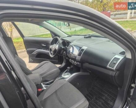 Черный Мицубиси Аутлендер ХЛ, объемом двигателя 2.36 л и пробегом 87 тыс. км за 11500 $, фото 5 на Automoto.ua
