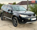 Черный Мицубиси Аутлендер ХЛ, объемом двигателя 2.4 л и пробегом 212 тыс. км за 9350 $, фото 1 на Automoto.ua