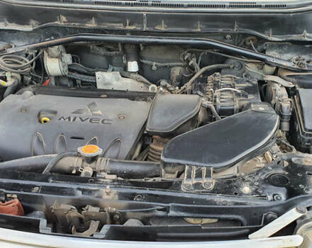 Черный Мицубиси Аутлендер ХЛ, объемом двигателя 2.4 л и пробегом 146 тыс. км за 10500 $, фото 10 на Automoto.ua