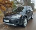 Черный Мицубиси Аутлендер ХЛ, объемом двигателя 3 л и пробегом 240 тыс. км за 9400 $, фото 1 на Automoto.ua