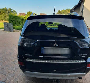 Черный Мицубиси Аутлендер ХЛ, объемом двигателя 2.4 л и пробегом 146 тыс. км за 10500 $, фото 6 на Automoto.ua