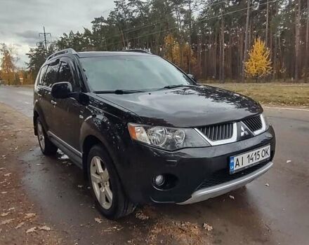Черный Мицубиси Аутлендер ХЛ, объемом двигателя 3 л и пробегом 240 тыс. км за 9400 $, фото 1 на Automoto.ua