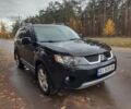 Черный Мицубиси Аутлендер ХЛ, объемом двигателя 3 л и пробегом 240 тыс. км за 9400 $, фото 1 на Automoto.ua