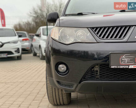 Черный Мицубиси Аутлендер ХЛ, объемом двигателя 2.4 л и пробегом 175 тыс. км за 10499 $, фото 8 на Automoto.ua