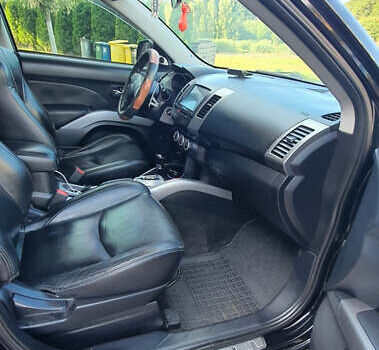 Черный Мицубиси Аутлендер ХЛ, объемом двигателя 2.4 л и пробегом 146 тыс. км за 10500 $, фото 9 на Automoto.ua