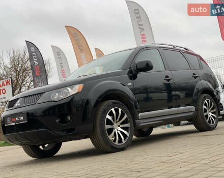 Черный Мицубиси Аутлендер ХЛ, объемом двигателя 2.4 л и пробегом 175 тыс. км за 10499 $, фото 1 на Automoto.ua