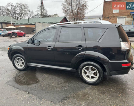 Черный Мицубиси Аутлендер ХЛ, объемом двигателя 2.36 л и пробегом 305 тыс. км за 10000 $, фото 1 на Automoto.ua