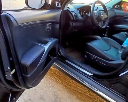 Черный Мицубиси Аутлендер ХЛ, объемом двигателя 2.3 л и пробегом 190 тыс. км за 12500 $, фото 11 на Automoto.ua