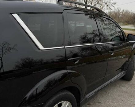 Черный Мицубиси Аутлендер ХЛ, объемом двигателя 2.18 л и пробегом 253 тыс. км за 12500 $, фото 7 на Automoto.ua