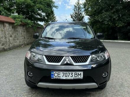 Черный Мицубиси Аутлендер ХЛ, объемом двигателя 3 л и пробегом 264 тыс. км за 9500 $, фото 1 на Automoto.ua