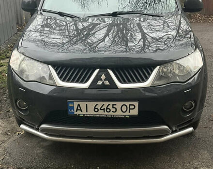 Черный Мицубиси Аутлендер ХЛ, объемом двигателя 3 л и пробегом 169 тыс. км за 9300 $, фото 1 на Automoto.ua