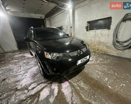 Черный Мицубиси Аутлендер ХЛ, объемом двигателя 3 л и пробегом 178 тыс. км за 8700 $, фото 1 на Automoto.ua