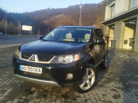 Черный Мицубиси Аутлендер ХЛ, объемом двигателя 3 л и пробегом 130 тыс. км за 6000 $, фото 1 на Automoto.ua
