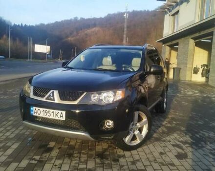 Черный Мицубиси Аутлендер ХЛ, объемом двигателя 3 л и пробегом 130 тыс. км за 6000 $, фото 1 на Automoto.ua