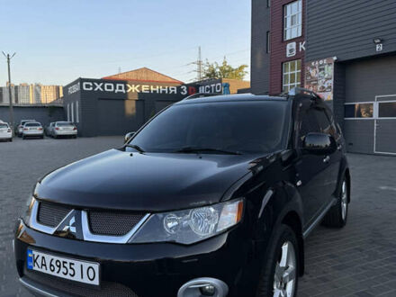 Черный Мицубиси Аутлендер ХЛ, объемом двигателя 3 л и пробегом 243 тыс. км за 12500 $, фото 1 на Automoto.ua