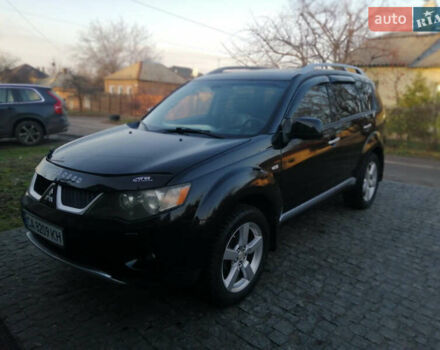 Черный Мицубиси Аутлендер ХЛ, объемом двигателя 2.38 л и пробегом 228 тыс. км за 7850 $, фото 1 на Automoto.ua