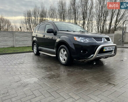 Черный Мицубиси Аутлендер ХЛ, объемом двигателя 2.36 л и пробегом 216 тыс. км за 7500 $, фото 1 на Automoto.ua