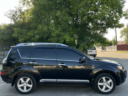 Черный Мицубиси Аутлендер ХЛ, объемом двигателя 2.99 л и пробегом 153 тыс. км за 10800 $, фото 1 на Automoto.ua