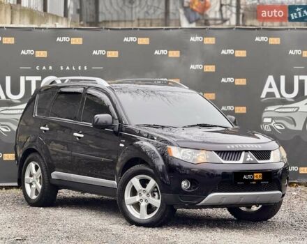 Черный Мицубиси Аутлендер ХЛ, объемом двигателя 3 л и пробегом 214 тыс. км за 9500 $, фото 1 на Automoto.ua