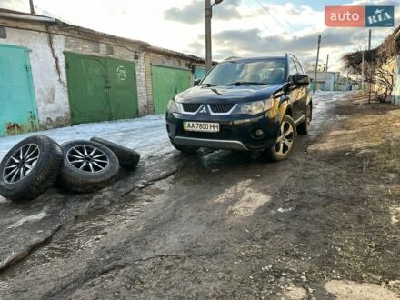 Черный Мицубиси Аутлендер ХЛ, объемом двигателя 2.4 л и пробегом 275 тыс. км за 8999 $, фото 1 на Automoto.ua