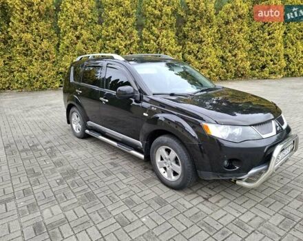 Черный Мицубиси Аутлендер ХЛ, объемом двигателя 2.4 л и пробегом 127 тыс. км за 10500 $, фото 1 на Automoto.ua