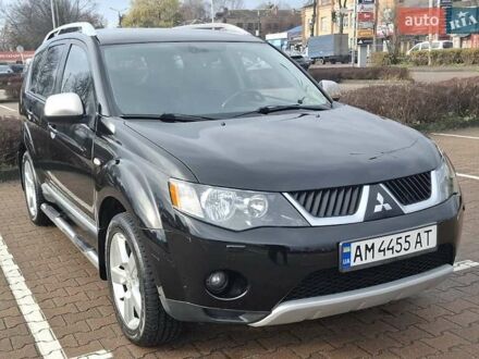 Черный Мицубиси Аутлендер ХЛ, объемом двигателя 2.36 л и пробегом 211 тыс. км за 10500 $, фото 1 на Automoto.ua