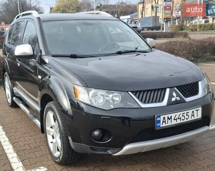 Черный Мицубиси Аутлендер ХЛ, объемом двигателя 2.36 л и пробегом 211 тыс. км за 10500 $, фото 1 на Automoto.ua