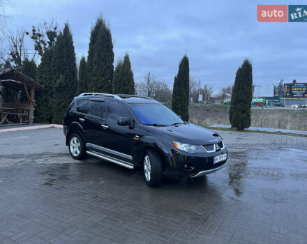 Черный Мицубиси Аутлендер ХЛ, объемом двигателя 2.36 л и пробегом 230 тыс. км за 9400 $, фото 1 на Automoto.ua