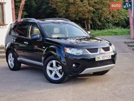 Черный Мицубиси Аутлендер ХЛ, объемом двигателя 2.36 л и пробегом 180 тыс. км за 7800 $, фото 1 на Automoto.ua