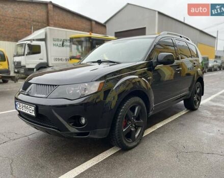 Черный Мицубиси Аутлендер ХЛ, объемом двигателя 2.4 л и пробегом 198 тыс. км за 9200 $, фото 1 на Automoto.ua