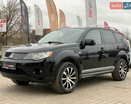Черный Мицубиси Аутлендер ХЛ, объемом двигателя 2.4 л и пробегом 175 тыс. км за 10499 $, фото 1 на Automoto.ua