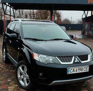 Чорний Міцубісі Аутлендер ХЛ, об'ємом двигуна 2.36 л та пробігом 150 тис. км за 11100 $, фото 1 на Automoto.ua