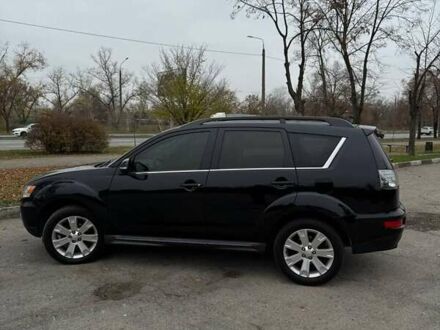 Черный Мицубиси Аутлендер ХЛ, объемом двигателя 2.18 л и пробегом 253 тыс. км за 12500 $, фото 1 на Automoto.ua