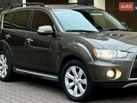 Коричневий Міцубісі Аутлендер ХЛ, об'ємом двигуна 2.36 л та пробігом 160 тис. км за 10900 $, фото 1 на Automoto.ua
