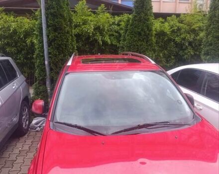 Красный Мицубиси Аутлендер ХЛ, объемом двигателя 2.4 л и пробегом 306 тыс. км за 10000 $, фото 2 на Automoto.ua